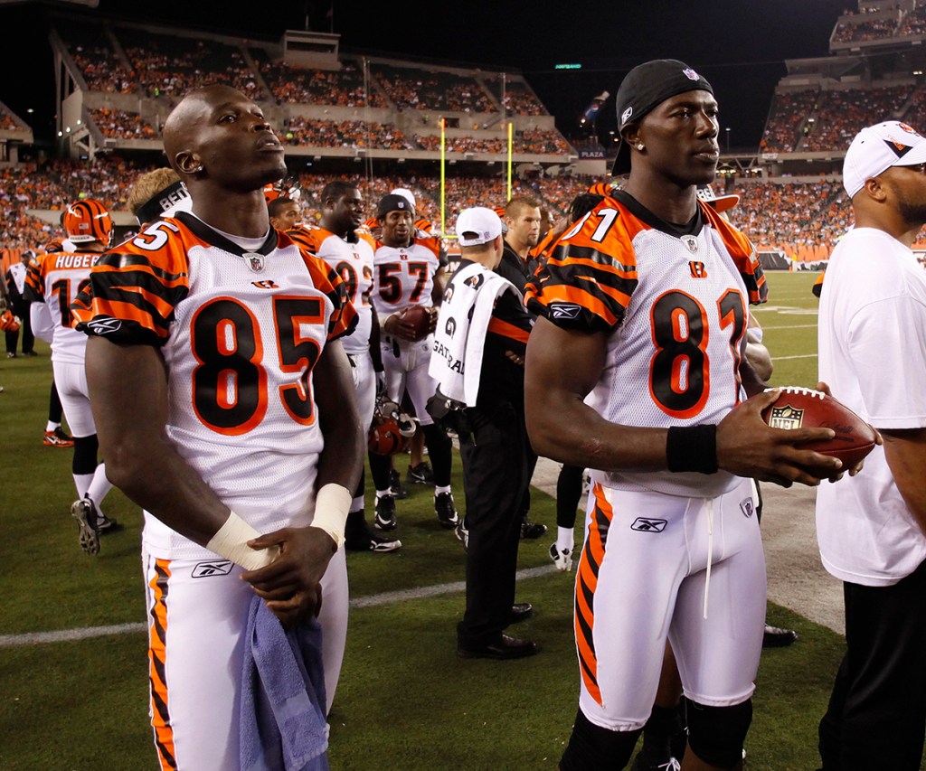 (L) Chad Ochocinco #85 and Terrell Owens #81 of the Cincinnati Bengals look on during the preseason game against the Denver Broncos at Paul Brown Stadium on August 15, 2010 in Cincinnati, Ohio. 
