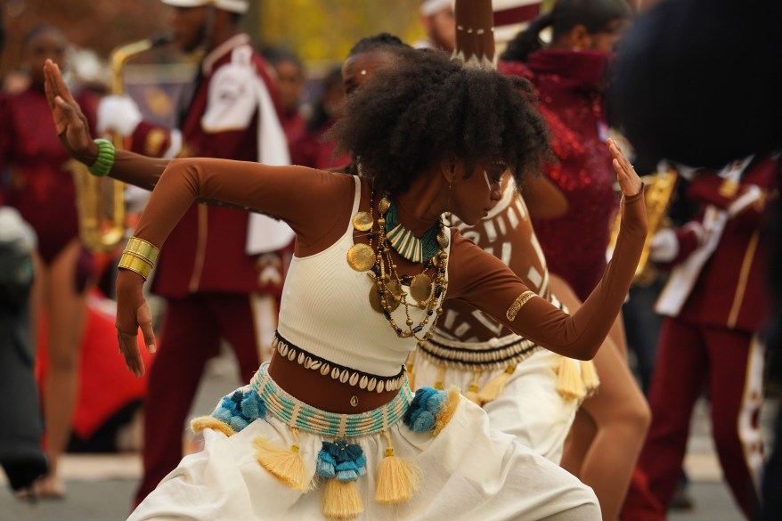 Performers and members of the Alabama Agricultural and Mechanical University perform at the Macy's Thanksgiving Day Parade route.