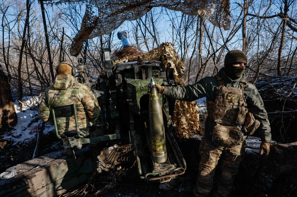 Servicemen of the 12th Special Forces Brigade Azov of the National Guard of Ukraine prepare to fire from a howitzer LH-70 towards Russian troops at a position near a frontline, amid Russia's attack on Ukraine, at an undisclosed location in Donetsk region, Ukraine, Nov. 22, 2023.