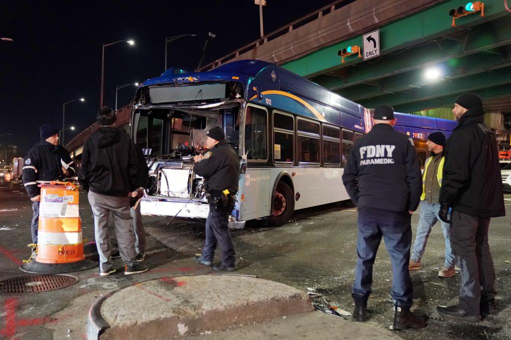 Emergency crews and police are spotted at the scene, as 13 people were taken to hospitals following the crash on Bruckner Boulevard in the Bronx on Dec. 20, 2023. 