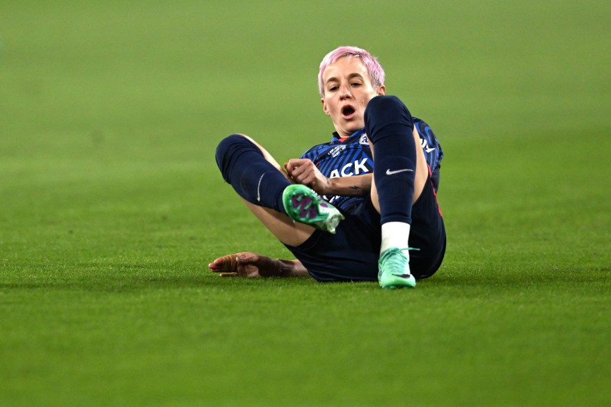 Megan Rapinoe reacts on the field after an injury in the early minutes of the first half of the National Women's Soccer League final match between OL Reign and Gotham FC at Snapdragon Stadium in San Diego, Calif., on Nov. 11, 2023. This was Rapinoe's last professional game of her soccer career.