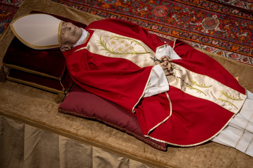 The body of late Pope Emeritus Benedict XVI laid out in state inside St. Peter's Basilica at The Vatican, Monday, Jan. 2, 2023.