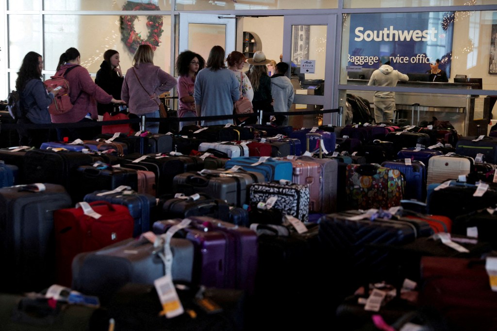 Southwest Airlines passengers wait in line at the baggage services office after the US airlines canceled thousands of flights due to a massive winter storm in December of 2022. 