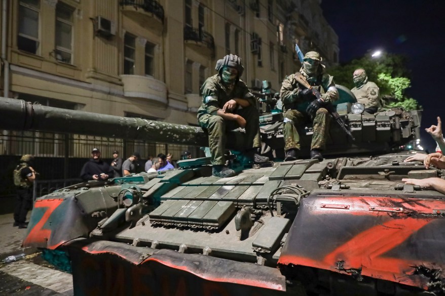 Members of the Wagner Group military company sit atop a tank on a street in Rostov-on-Don, Russia, Saturday, June 24, 2023. The Wagner Group staged a rebellion the day before after a period of increasing tensions between the Russian Ministry of Defence and it's then-leader, Yevgeny Prigozhin. 