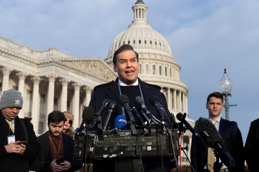 Rep. George Santos talks to reporters in front of the Capitol on Thursday, Nov. 30, a day before he was expelled from Congress.