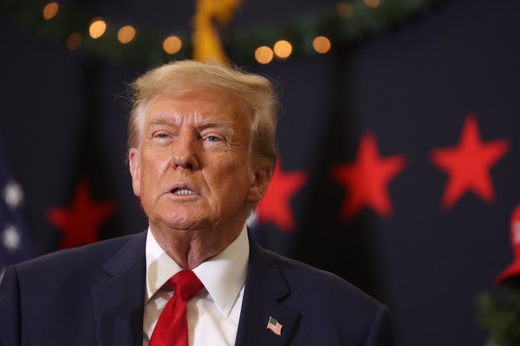 Republican presidential candidate and former U.S. President Donald Trump looks on during a campaign event on December 19, 2023 in Waterloo, Iowa.