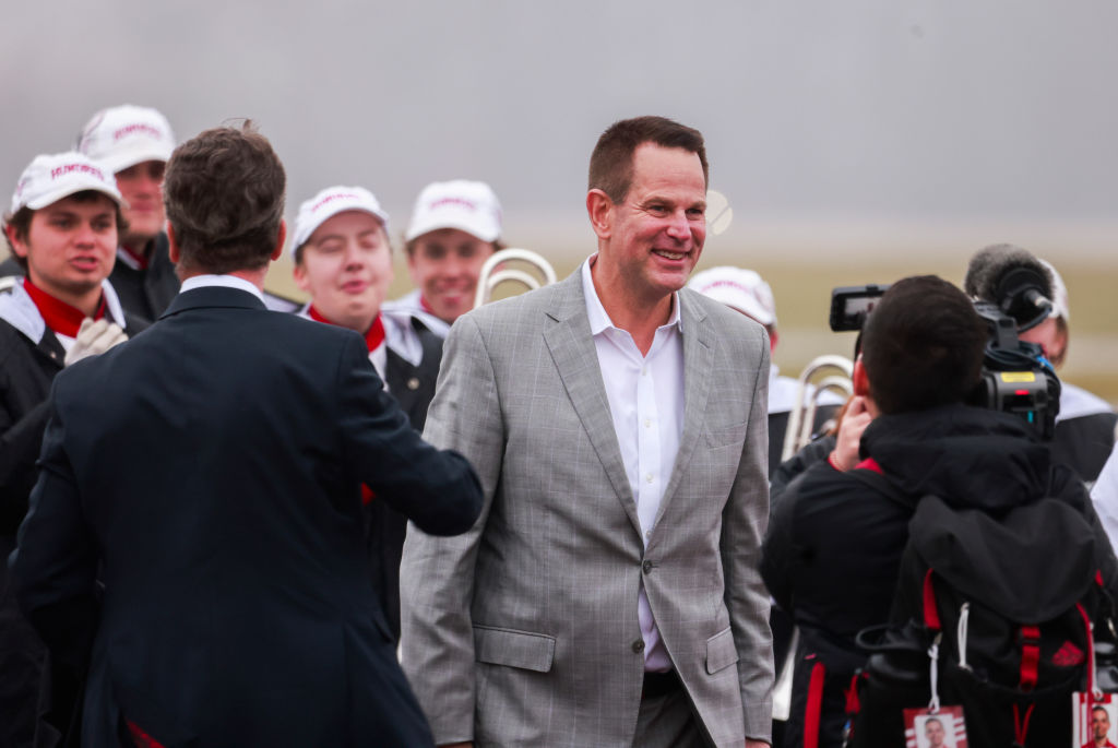 Indiana football coach Curt Cignetti is greeted by the band when he arrives in Bloomington.