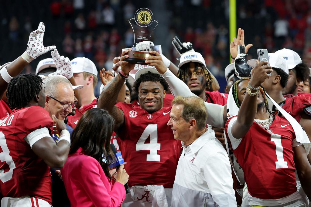 Jalen Milroe, who was named MVP of the game, celebrates with his teammates after Alabama's 27-24 win over No. 1 Georgia in the SEC Championship.