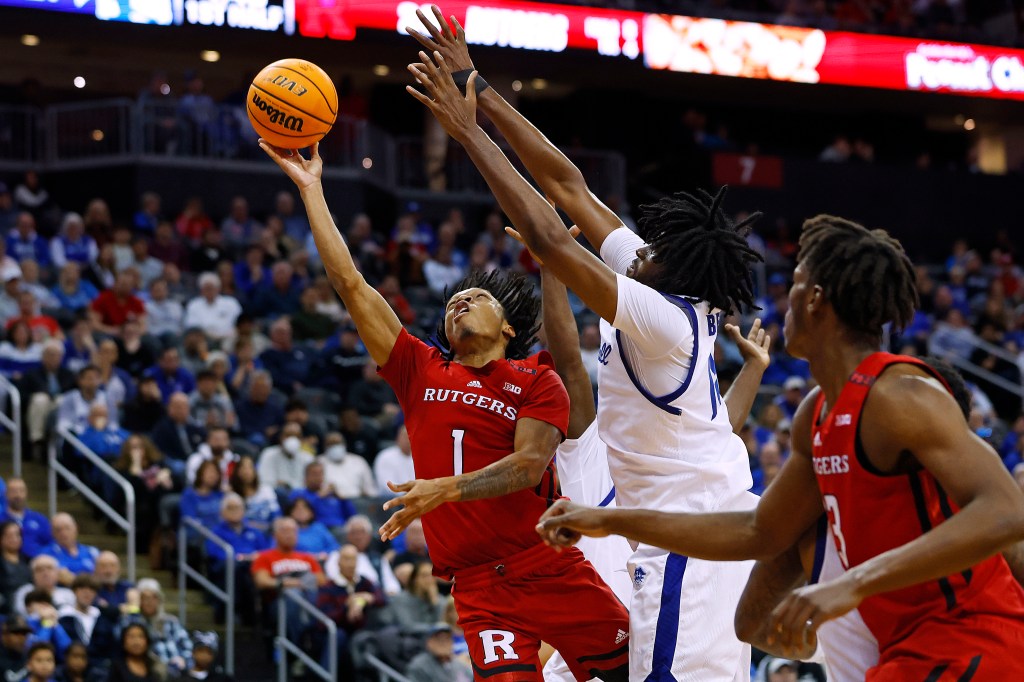 Jamichael Davis goes up for a layup as Seton Hall's Jaden Bediako defends during Rutgers' win.