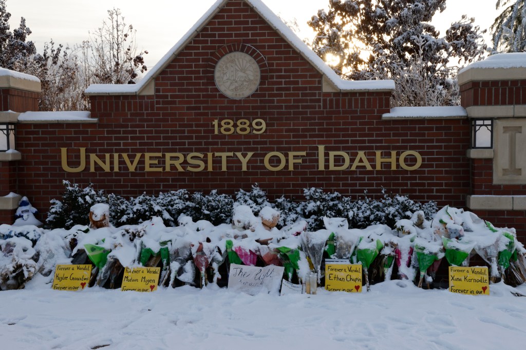 A makeshift memorial in front of a University of Idaho wall for the four students who were killed. 