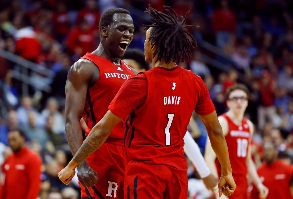 Mawot Mag, who played in his first game since February, chest bumps in celebration with Jamichael Davis during Rutgers' 70-63 win over Seton Hall.