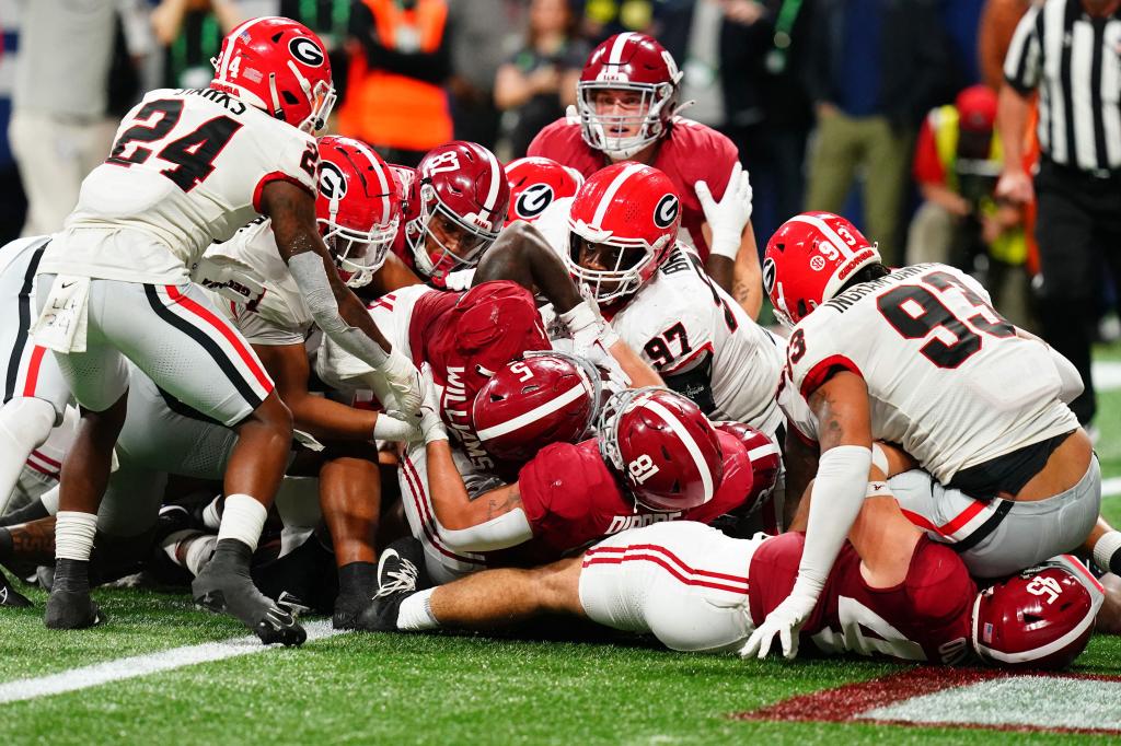 Crimson Tide running back Roydell Williams dives in for a touchdown during the fourth quarter of Alabama's 27-24 win over Georgia.