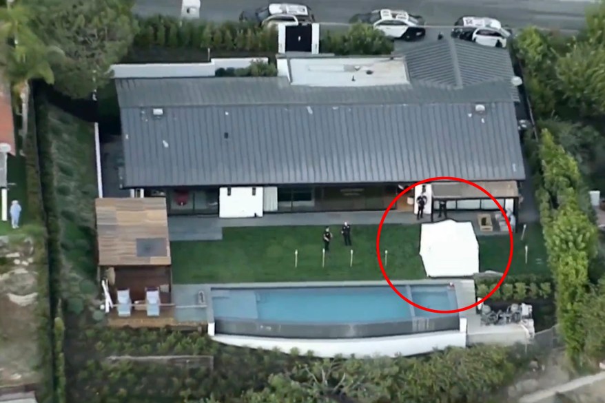 A white police tent is seen in the backyard of actor Matthew Perry's Los Angeles home after first responders were called for a reported drowning, Saturday evening, Oct. 28, 2023.