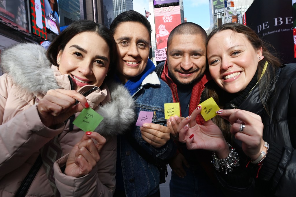 Alexa Rodriguez, Elena Mejia, Isaac Ramirez, and Daniela Saenger holding their wishes