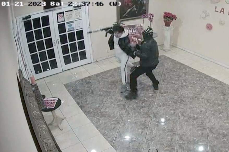 Astonishing surveillance footage showed the moment Brandon Tsay (left) tackled mass shooter Huu Can Tran by grabbing his semi-automatic assault pistol, in a dance hall in Monterey Park, CA. Jan 21. 2023.