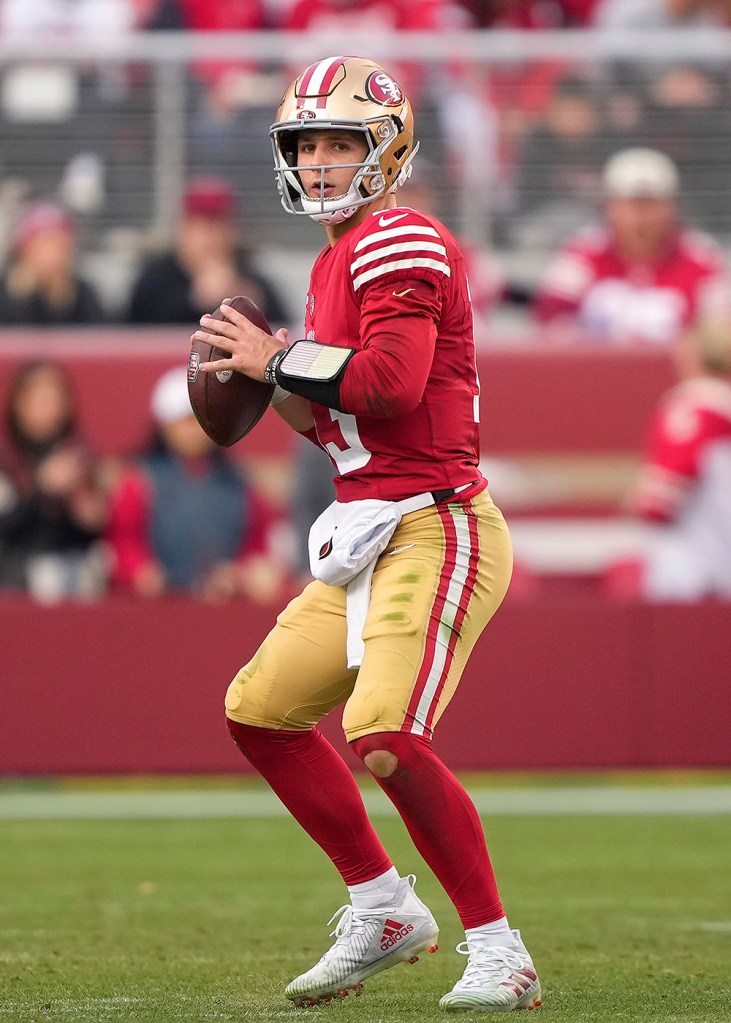 San Francisco 49ers Brock Purdy drops back to pass against the Seattle Seahawks during the fourth quarter of an NFL football game at Levi's Stadium on December 10, 2023 in Santa Clara, California.  