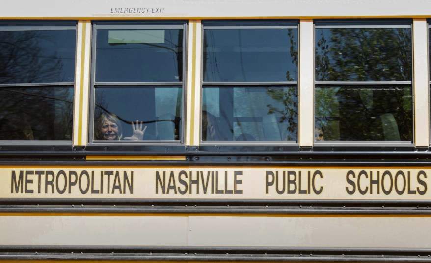 A child weeps while on the bus leaving The Covenant School after a mass shooting in Nashville, Tennessee, on March 27, 2023. 