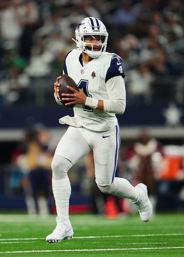 Cowboys quarterback Dak Prescott drops back to pass against the Philadelphia Eagles during the second half at AT&T Stadium on December 10, 2023 in Arlington, Texas.  