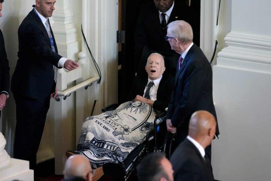 Former President Jimmy Carter arrives to attend a tribute service for his wife and former first lady Rosalynn Carter, at Glenn Memorial Church, in Atlanta, Tuesday, Nov. 28, 2023.