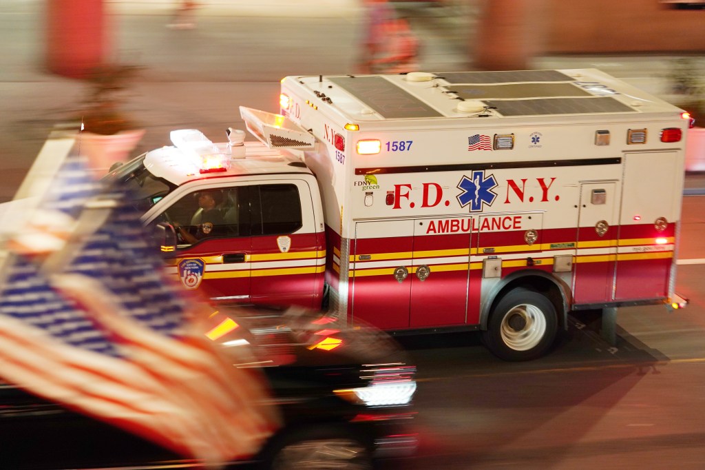 An FDNY ambulance races down a city street.