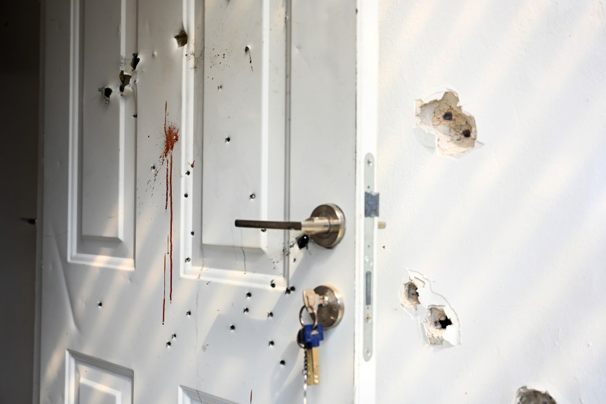 Gunshots and blood stains are seen on a door and walls of a house where civilians were killed days earlier in an attack by Hamas militants on this kibbutz near the border with Gaza, on October 10, 2023 in Kfar Aza, Israel.