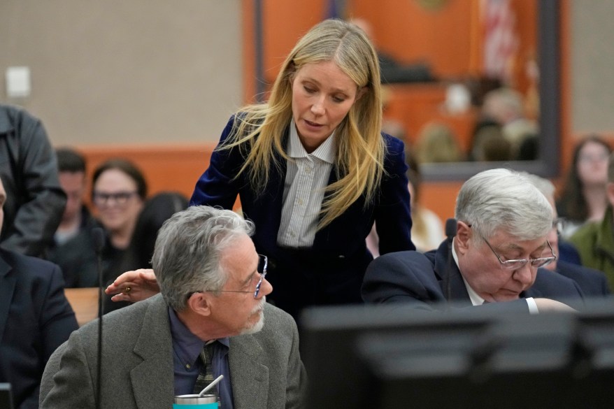 Gwyneth Paltrow speaks with retired optometrist Terry Sanderson, left, as she walks out of the courtroom following the reading of the verdict in their lawsuit trial, Thursday, March 30, 2023, in Park City, Utah. Paltrow won her court battle over a 2016 ski collision at a Utah ski resort after a jury decided that the movie star wasn't at fault for the crash.