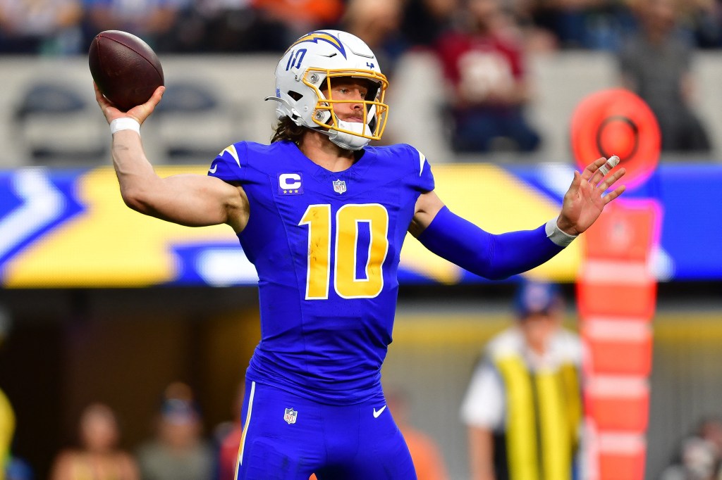 Justin Herbert throws a pass during the Chargers-Broncos game on Dec. 10.