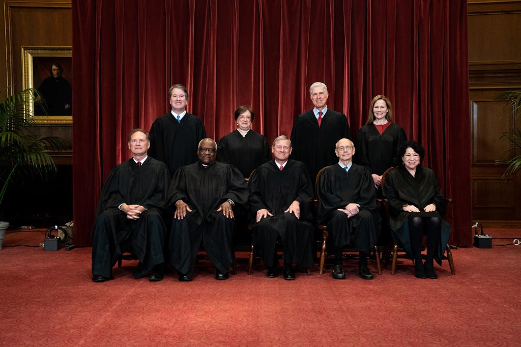 Members of the Supreme Court pose for a group photo at the Supreme Court in Washington, DC on April 23, 2021.