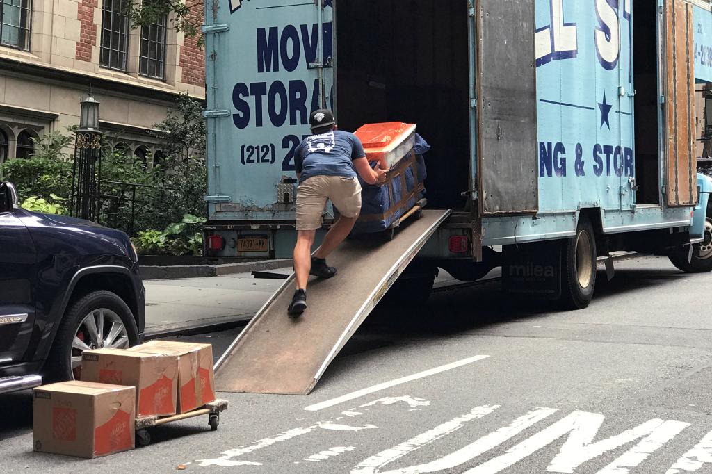 A mover puts belongings into a moving truck following the outbreak of the coronavirus disease (COVID-19) in the Manhattan borough of New York City, New York, U.S., September 1, 2020