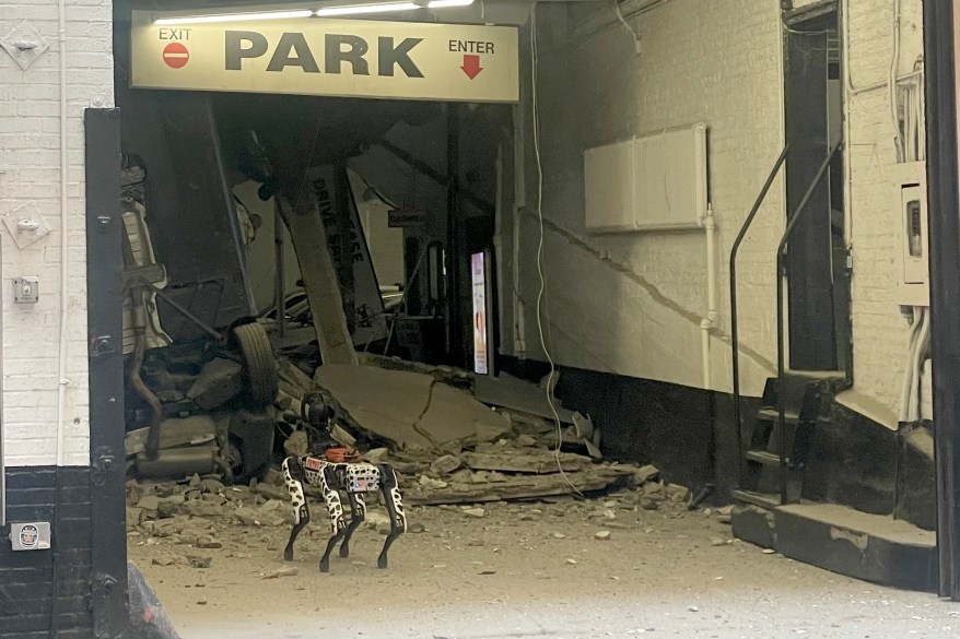 The FDNY deploys a robot dog into the rubble of the Lower Manhattan parking garage that collapsed to look for survivors and assess the destruction that killed one person and injured five on April 18, 2023.