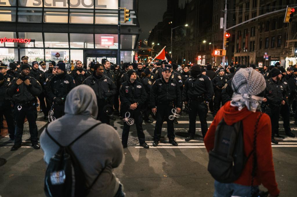 Pro Palestine protesters gather by Union Square after a march on Christmas Day.