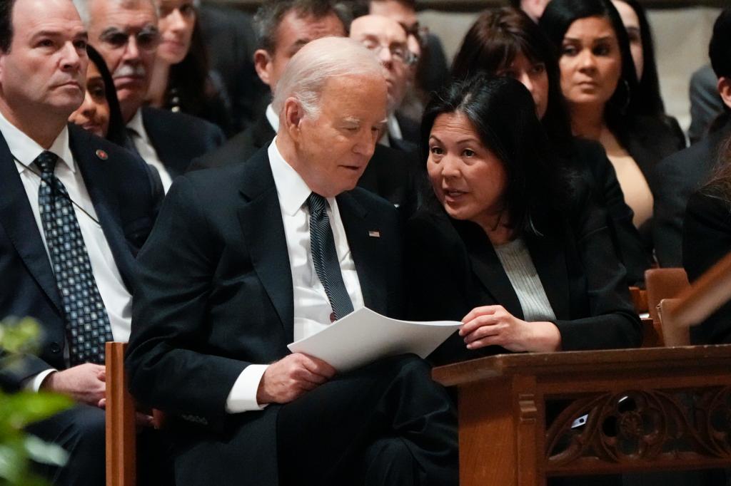 President Joe Biden talks with Acting Secretary of Labor Julie Su before a funeral service for retired Supreme Court Justice Sandra Day O'Connor at the Washington National Cathedral, Tuesday, Dec. 19, 2023, in Washington.