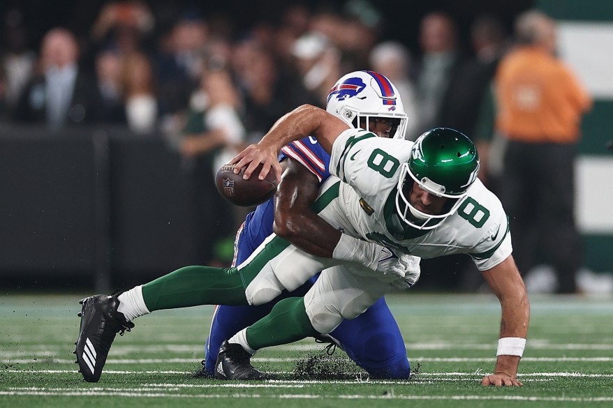 Aaron Rodgers goes down with an injury on just the fourth snap of his Jets debut at MetLife Stadium on Sept. 11, 2023. 