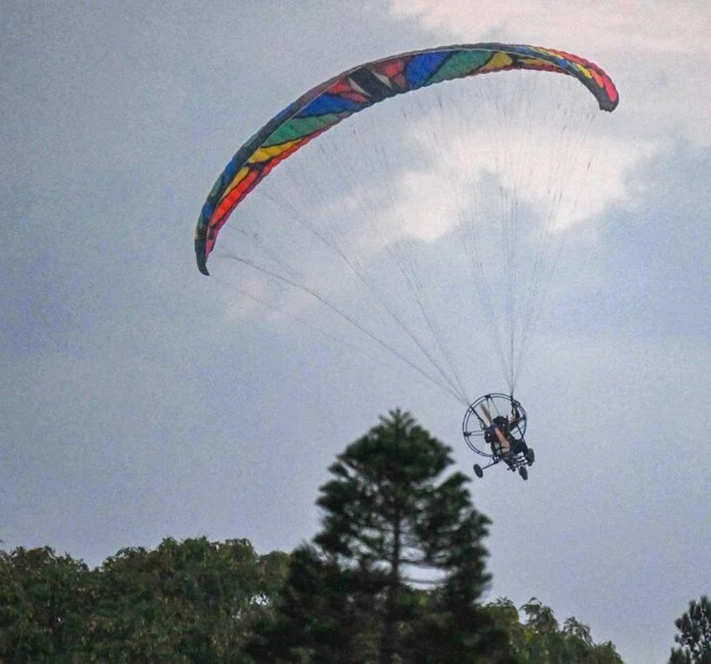 Palestinian terrorists paragliding into Israel on Oct. 7, photographed by Gilad Kfir before he was killed.