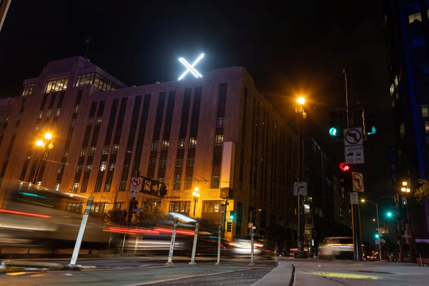 A newly installed 'X' logo is seen on the top of the headquarters of the messaging platform X, formerly known as Twitter, in downtown San Francisco on July 30, 2023.