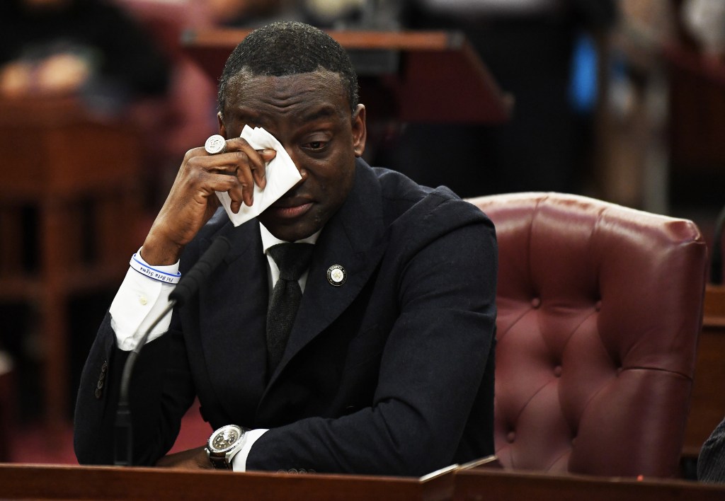 Councilman Yusef Salaam wiping away tears while speaking before the vote.