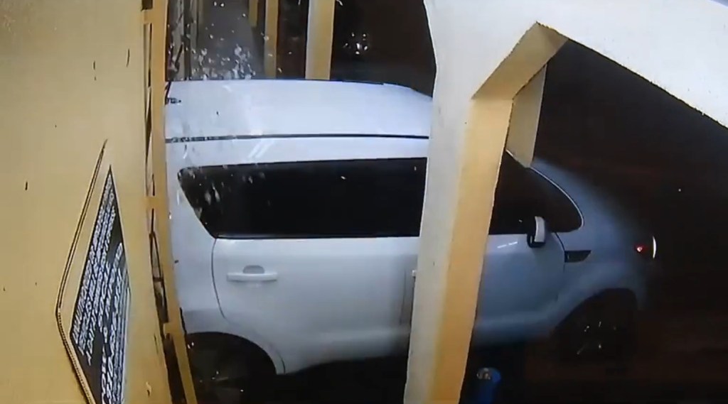 One driver used a white Kia to smash into the store's front doors to create an entrance for the looters.