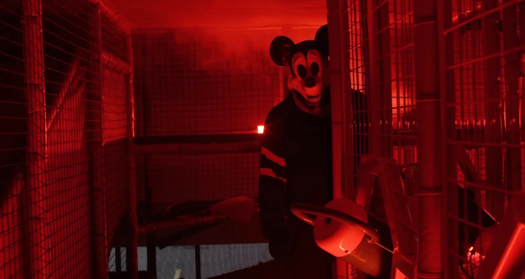 Mickey Mouse in sinister red lighting. 