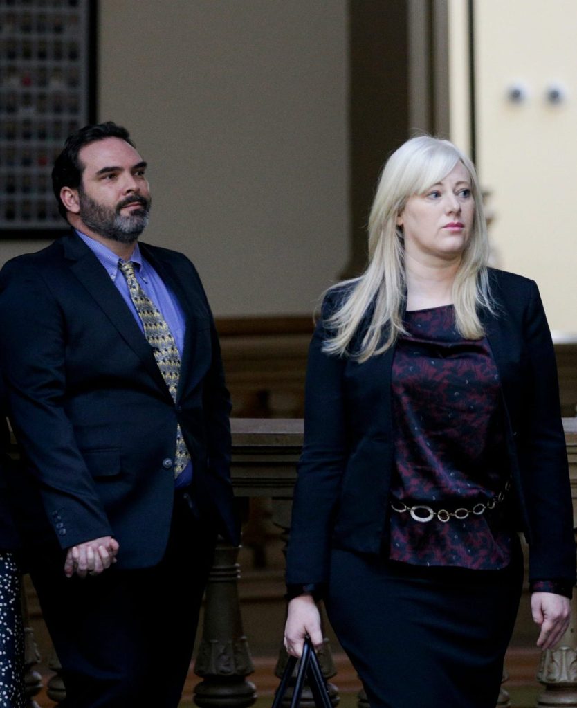 Michael Barnett, left, and ex-wife, Kristine Barnett, walk out of court.