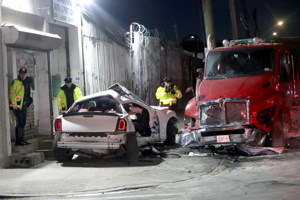 A crashed Chrysler 300M with U-Haul markings on the side near the intersection of Bryant and Viele Avenues in Hunts Point.