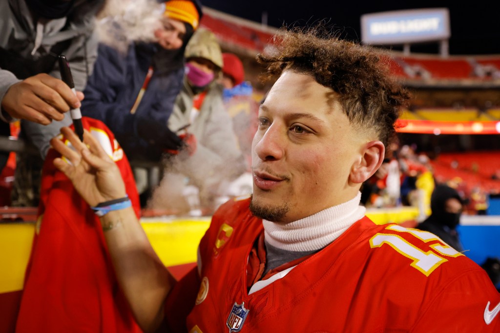 Patrick Mahomes celebrates the Chiefs' wild-card win with fans in what was the fourth coldest game in NFL history.