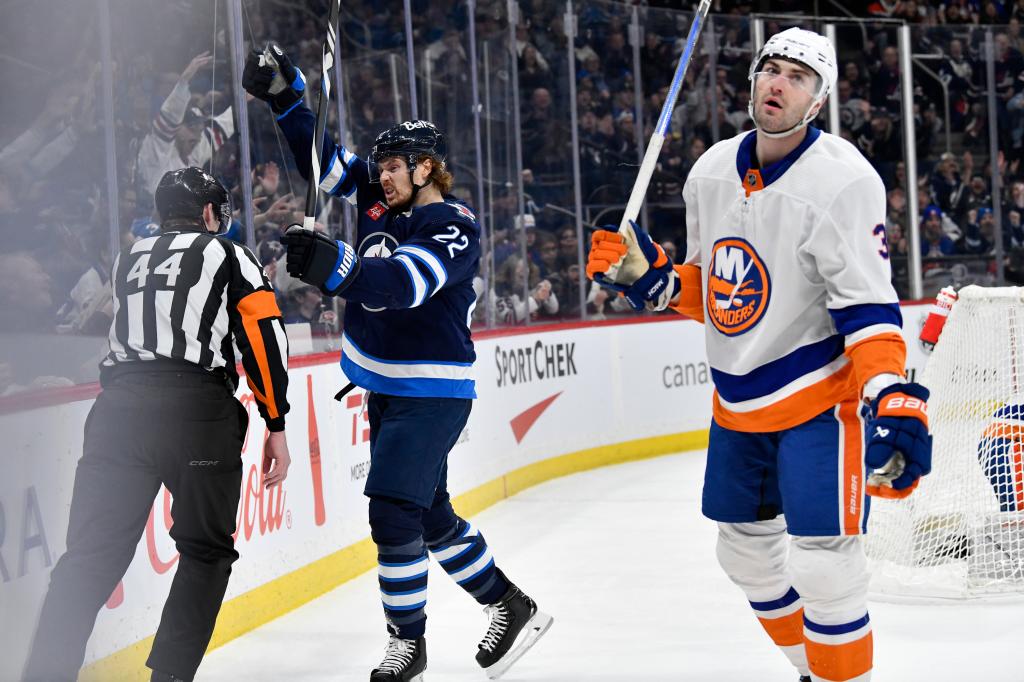 Winnipeg Jets' Mason Appleton (22) celebrates his goal as New York Islanders' Adam Pelech (3) looks away.
