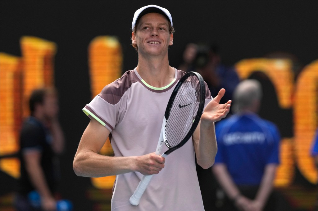 Jannik Sinner celebrates after upsetting Novak Djokovic in the Australian Open semifinals.