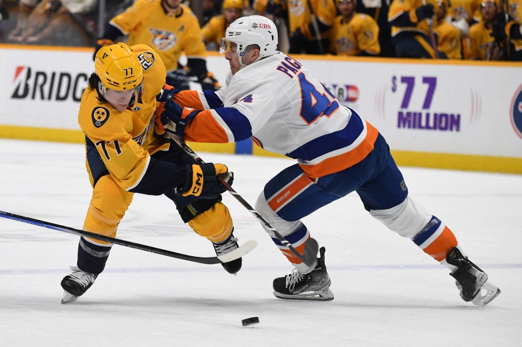 Jean-Gabriel Pageau, who scored the Islanders' lone goal, checks Luke Evangelista during the Predators' win. 