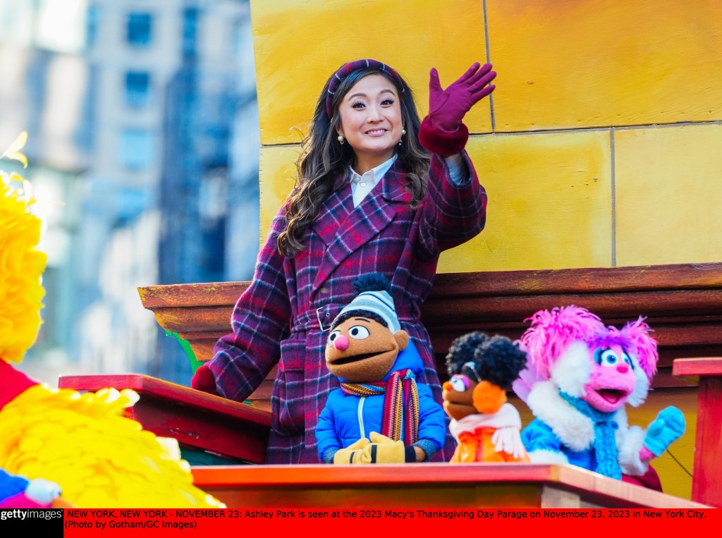 Ashley Park waves to the crowd at the 2023 Macy's Thanksgiving Day Parade in Manhattan.