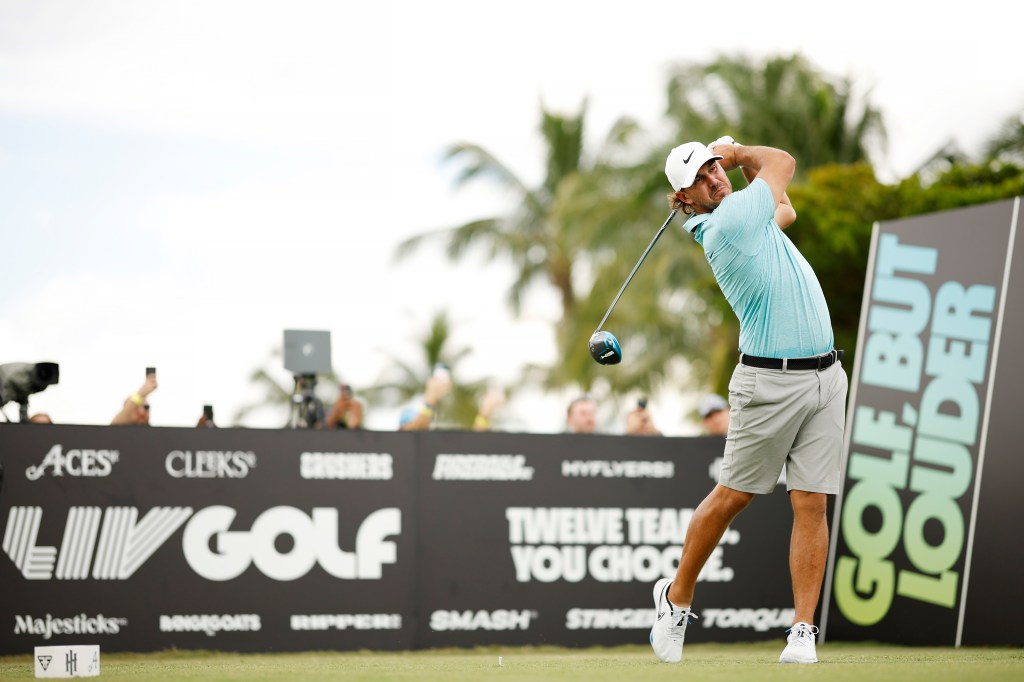 Brooks Koepka hits his shot during a LIV Golf event in October 2023.