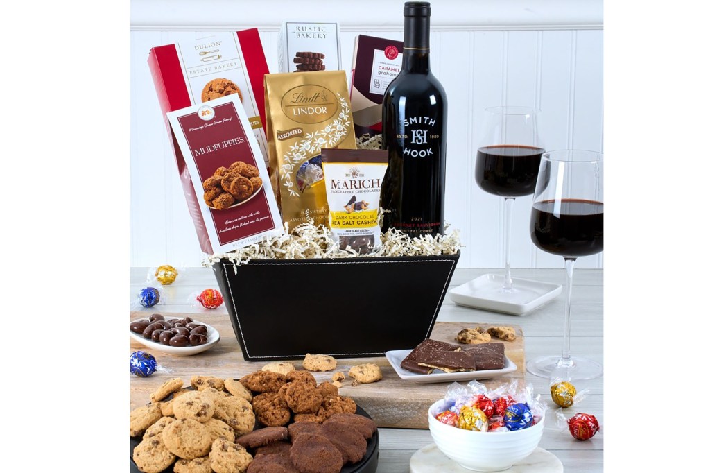 A basket filled with food and wine