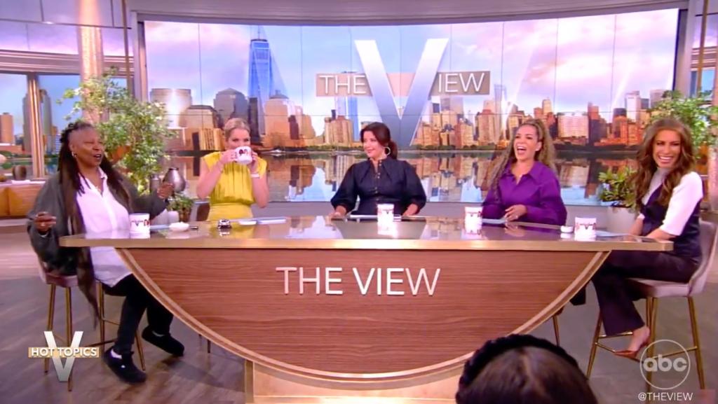 "Woo," jeered moderator Whoopi Goldberg as she danced her way to the show's Hot Topic's desk as the tune, which was played in lieu of the talk show's normal theme, blared overhead. 