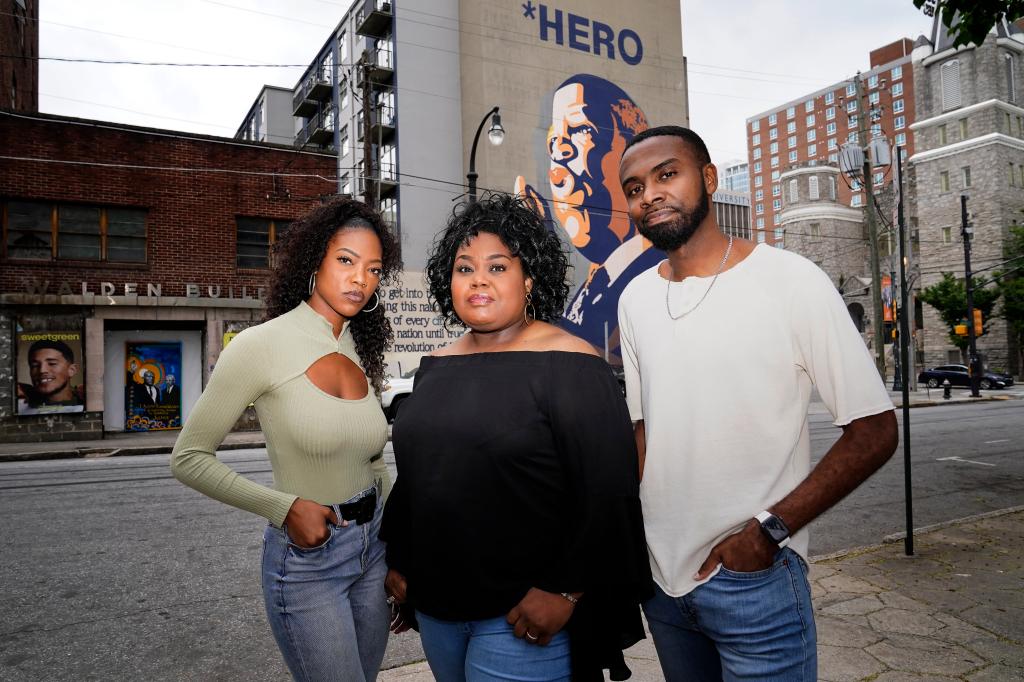 D'Zhane Parker, Cicley Gay and Shalomyah Bowers standing in front of a building in Atlanta