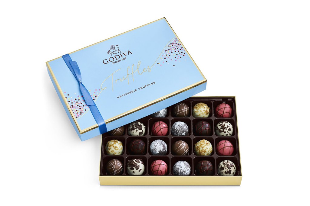 A box of chocolates with a blue ribbon.